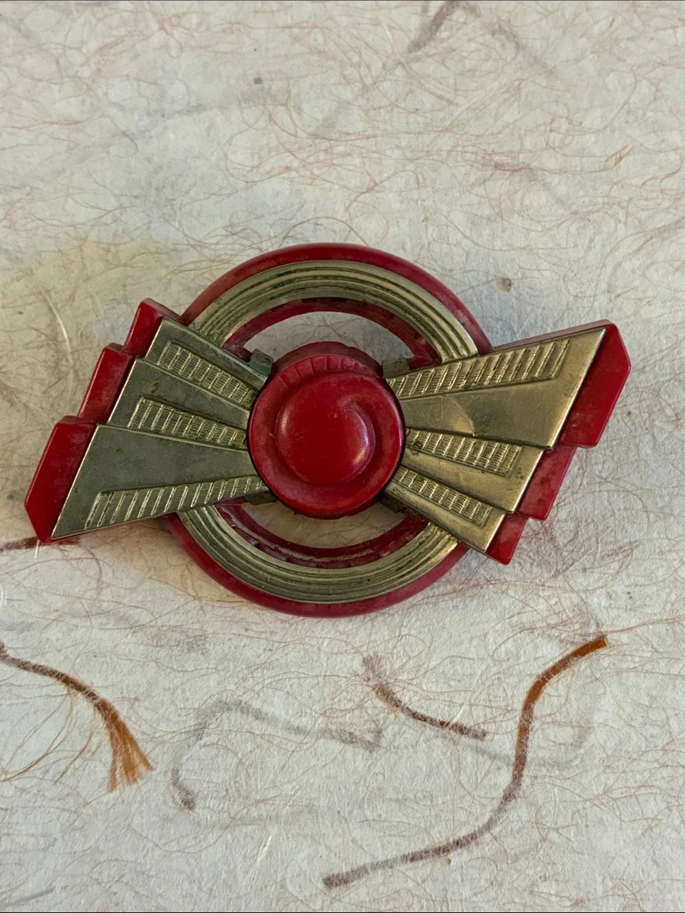 Machine Age Art Deco red Bakelite brooch with chrome overlay
